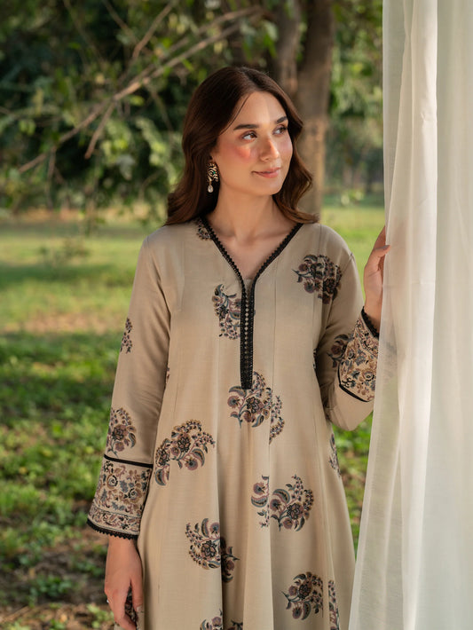 Model wearing Dune Mist beige cotton stitched suit with intricate screen print by Garnet Clothing