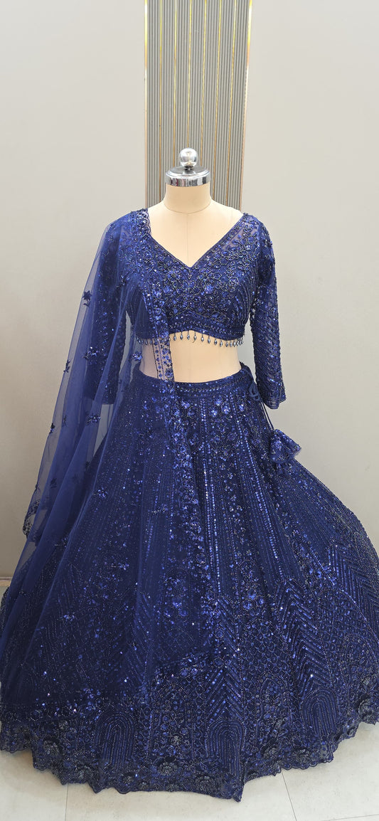 Royal navy blue designer party-wear lehenga with intricate zari and sequence embroidery by Tajori