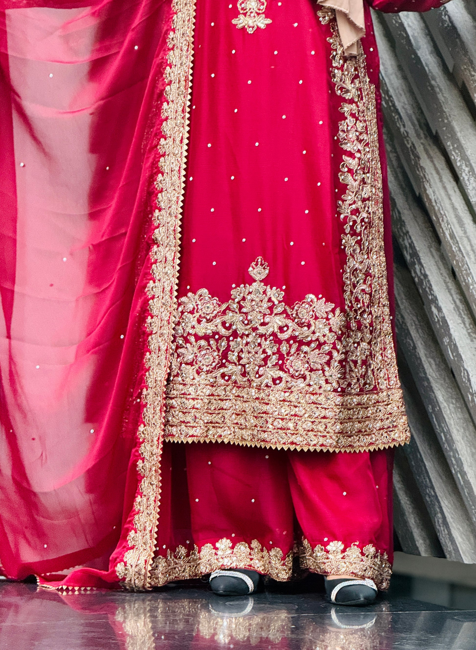 Model wearing Haseens Official Lamyah maroon 3 piece and 4 piece sharara set, get best Pakistani unstitched and stitched suits online at Tajori.