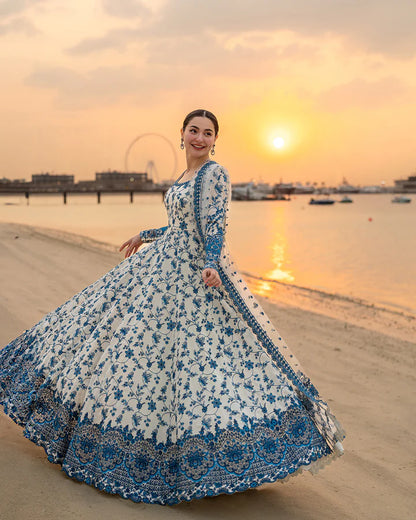 Hania Aamir posing in Faiza Saqlain Jehona lawn suit with flared design, sunset background