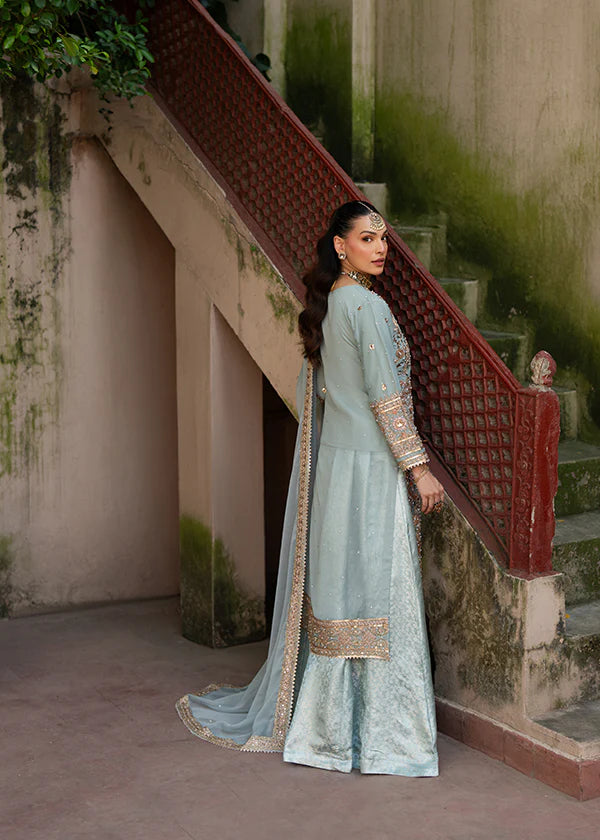 Back view of luxury stitched lehenga silhouette with premium embroidery details