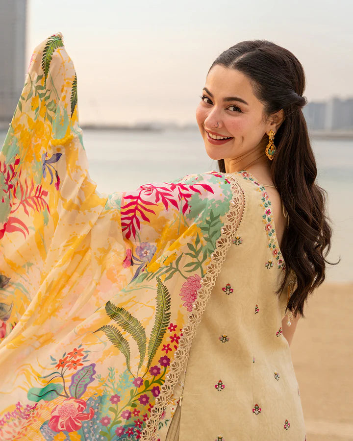 Hania Aamir posing in Faiza Saqlain Merjem vanilla lawn suit, intricate floral embroidery detail
