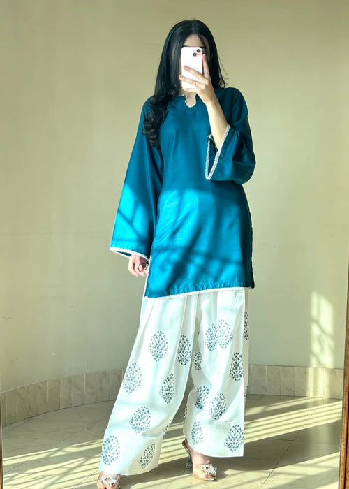 Full-length shot of Tehzeeb Libas teal kurta and white printed farsi set, ready to wear