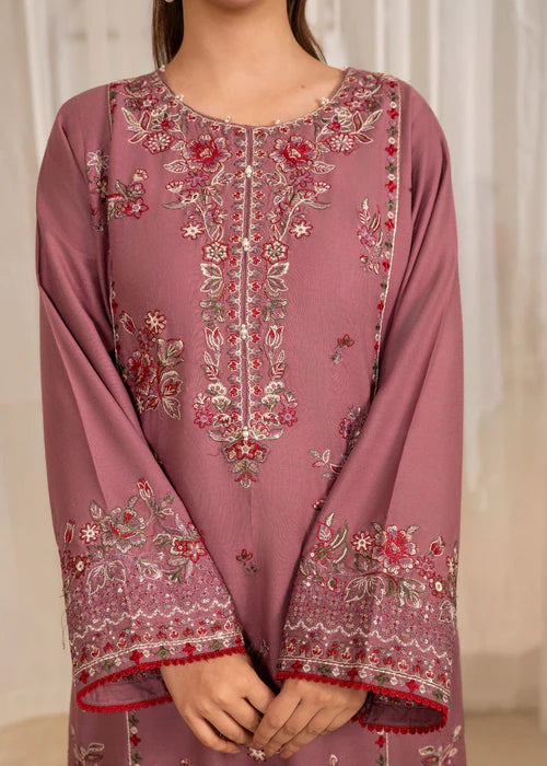 Mauve embroidered traditional outfit with floral patterns on a neutral background
