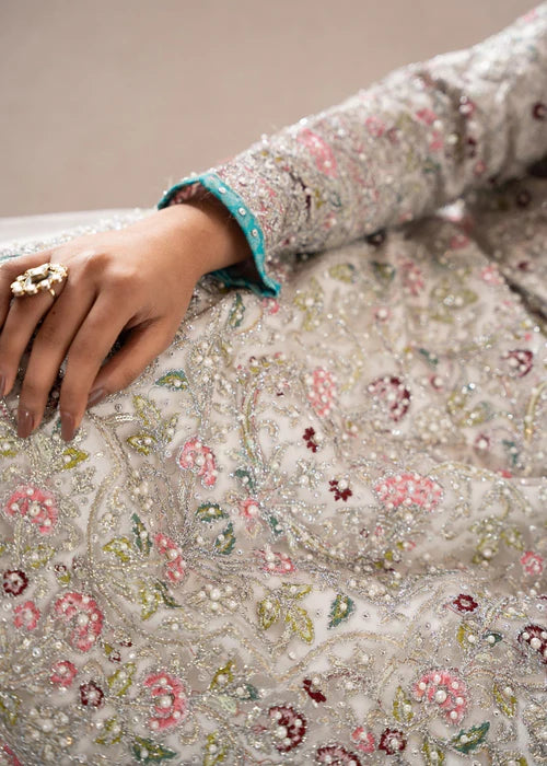 Intricate hand-embroidery and beadwork detail on Zarghona net lehenga dress